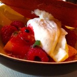 YamT'cha - mango garnished with blanc-manger, raspberries and passionfruit seeds under a pane of brown sugar with jasmine scented green tea by Alexander Lobrano