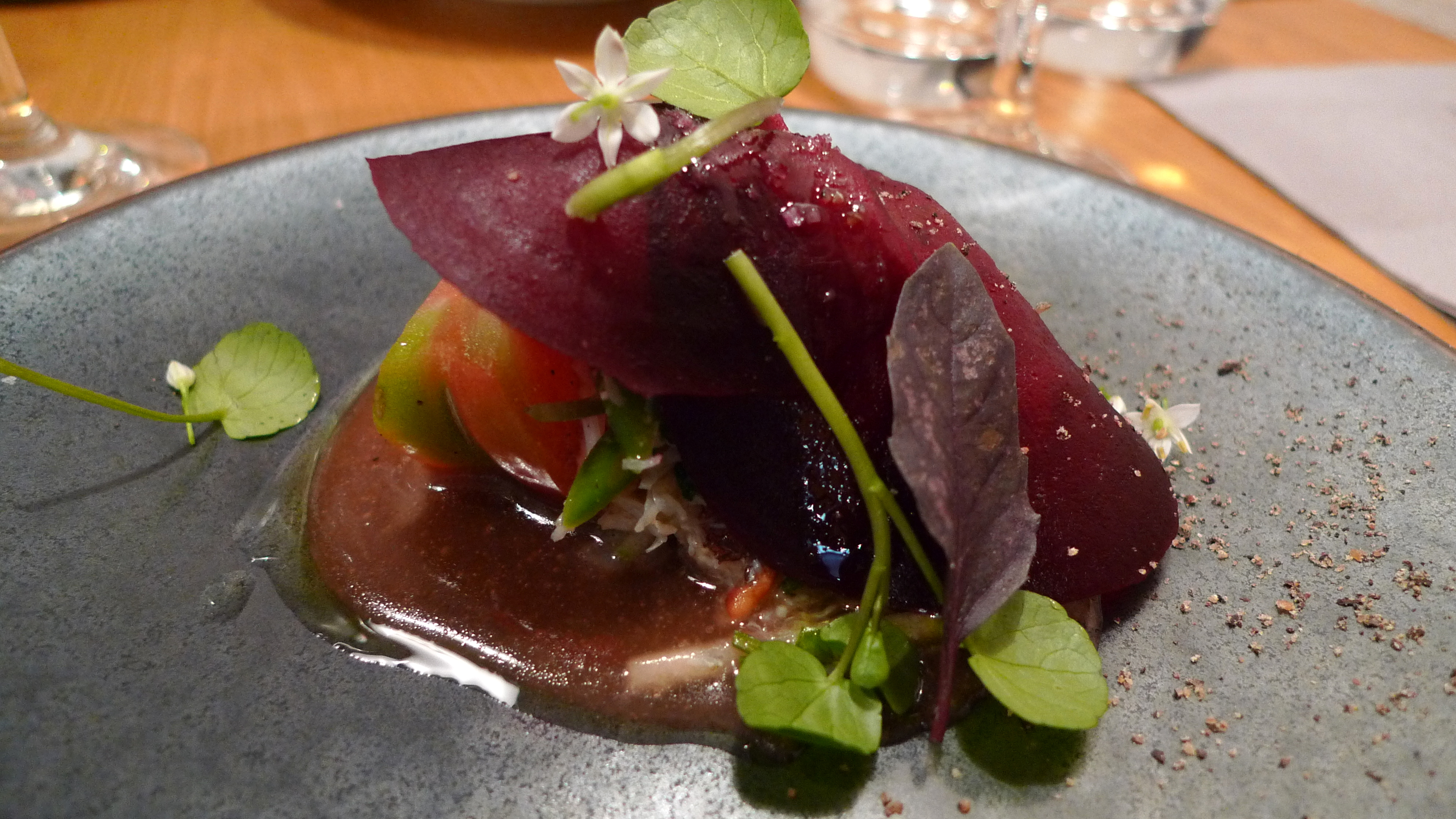 Shaved beet atop crab, heirloom tomatoes and miso vinaigrette