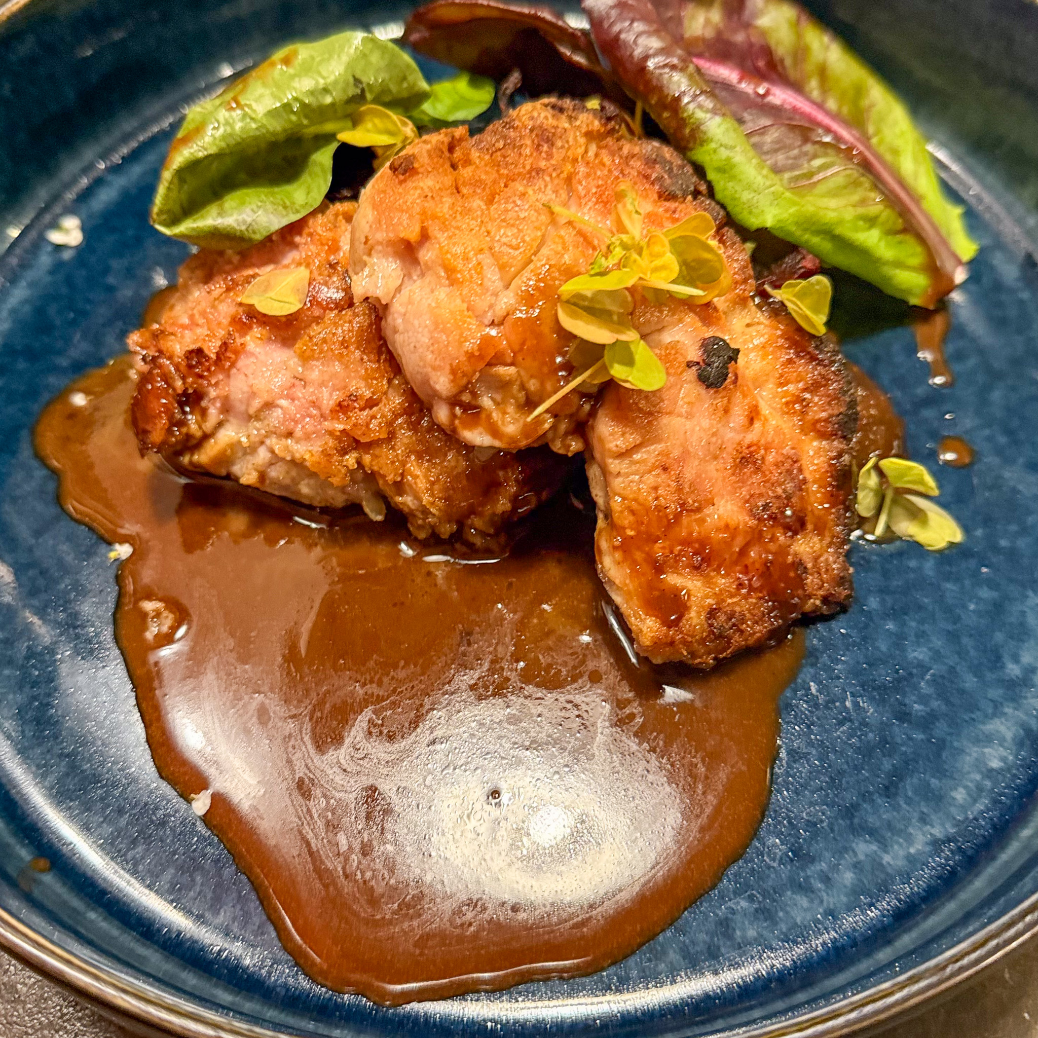 Crispy sweetbread with beet and plum compote on blue ceramic, Quedubon, 19th arrondissement, Paris