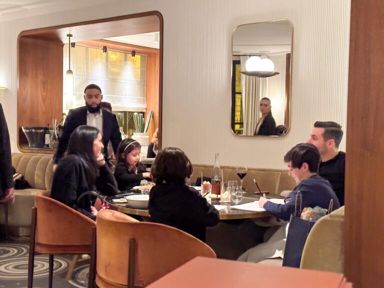 Guests at Les Parisiens restaurant in Paris