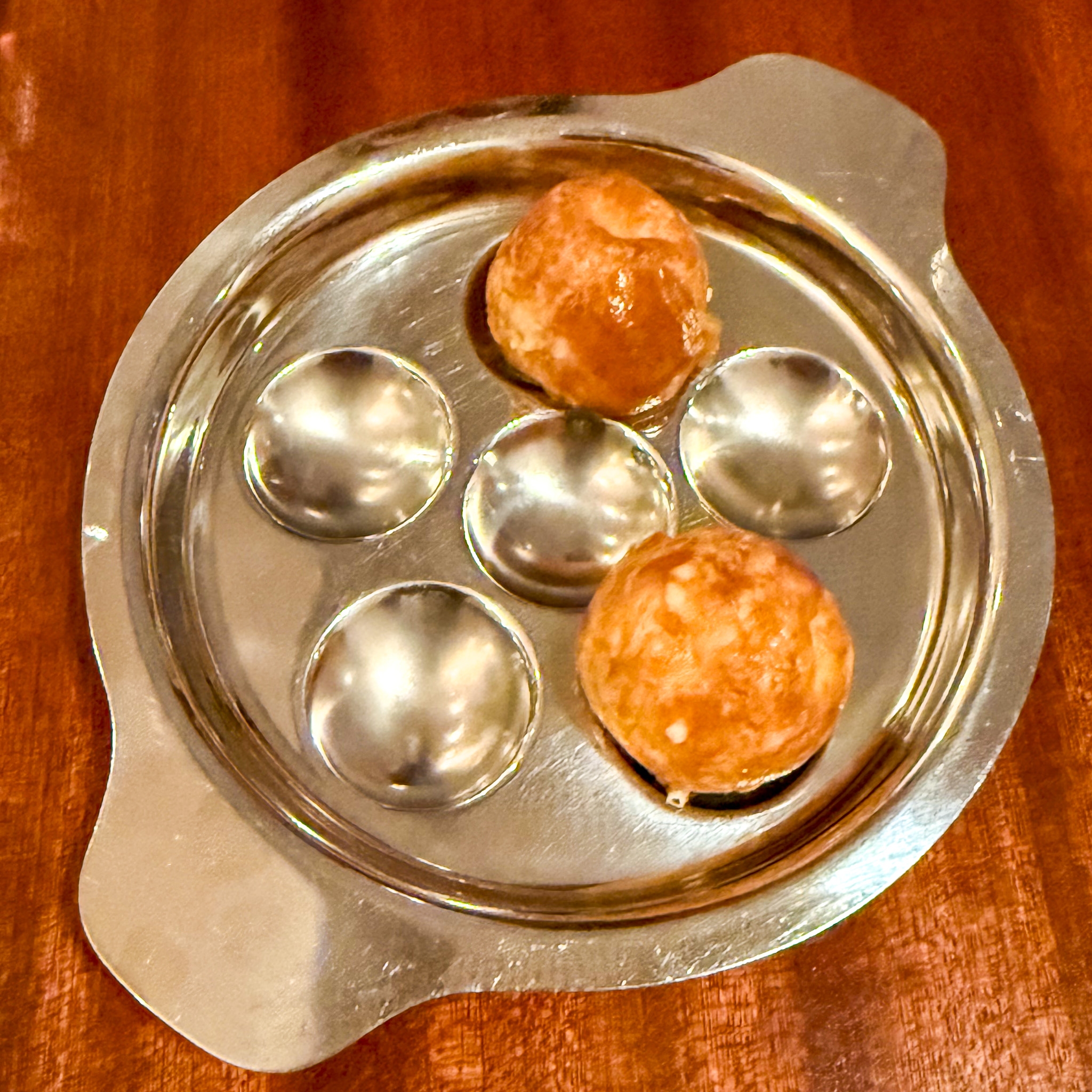gougeres-cacio-e-pepe-occasion-paris | PARIS BY MOUTH Cacio e pepe gougères in a silver snail dish at Occasion, Goncourt, Paris