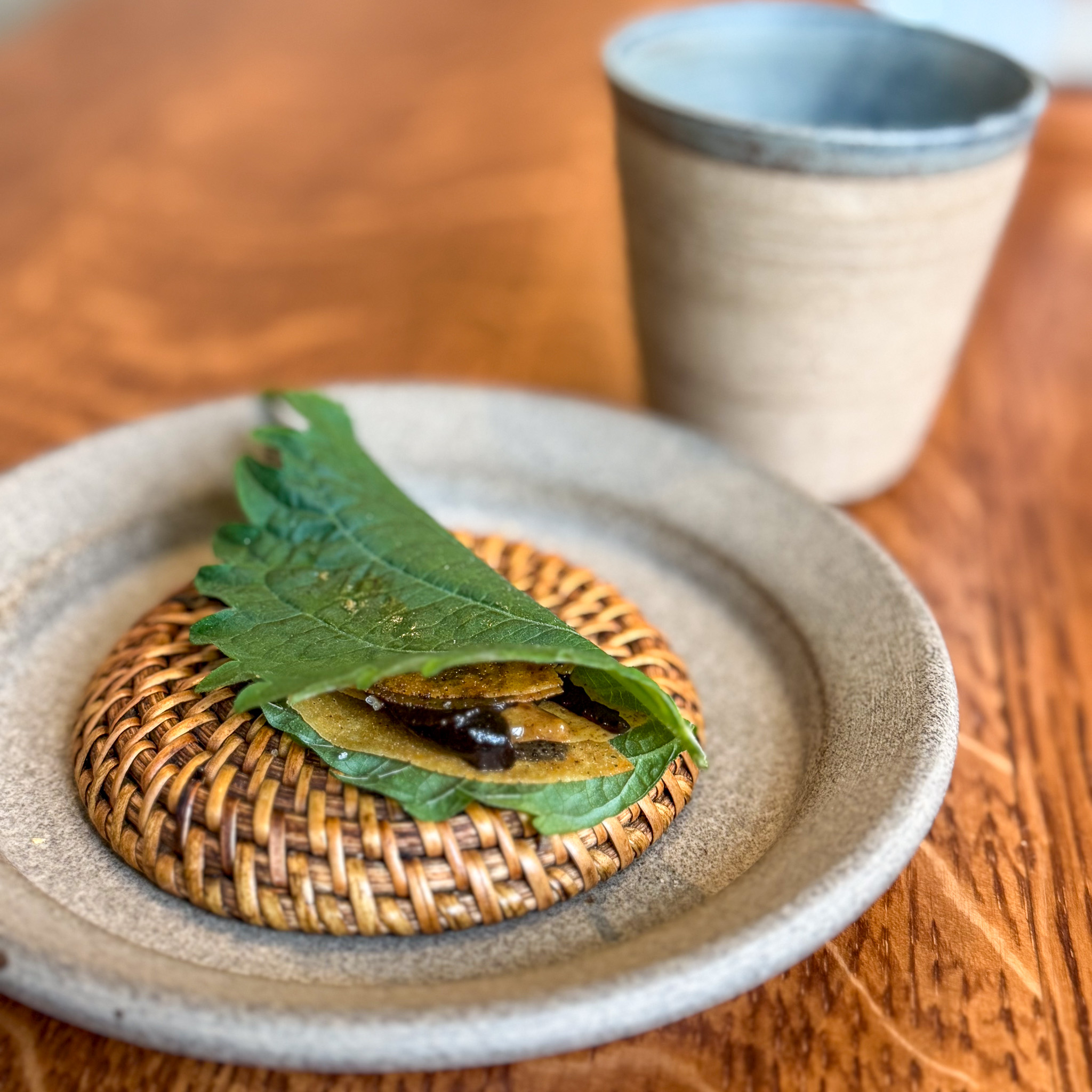 Shiso, black garlic and chicken skin at Eme, Marais, Paris