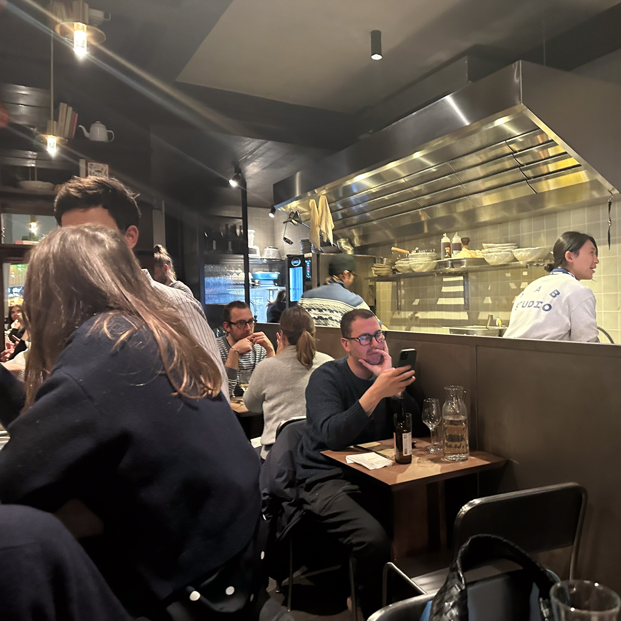 Dining room with open kitchen at Jip in Paris