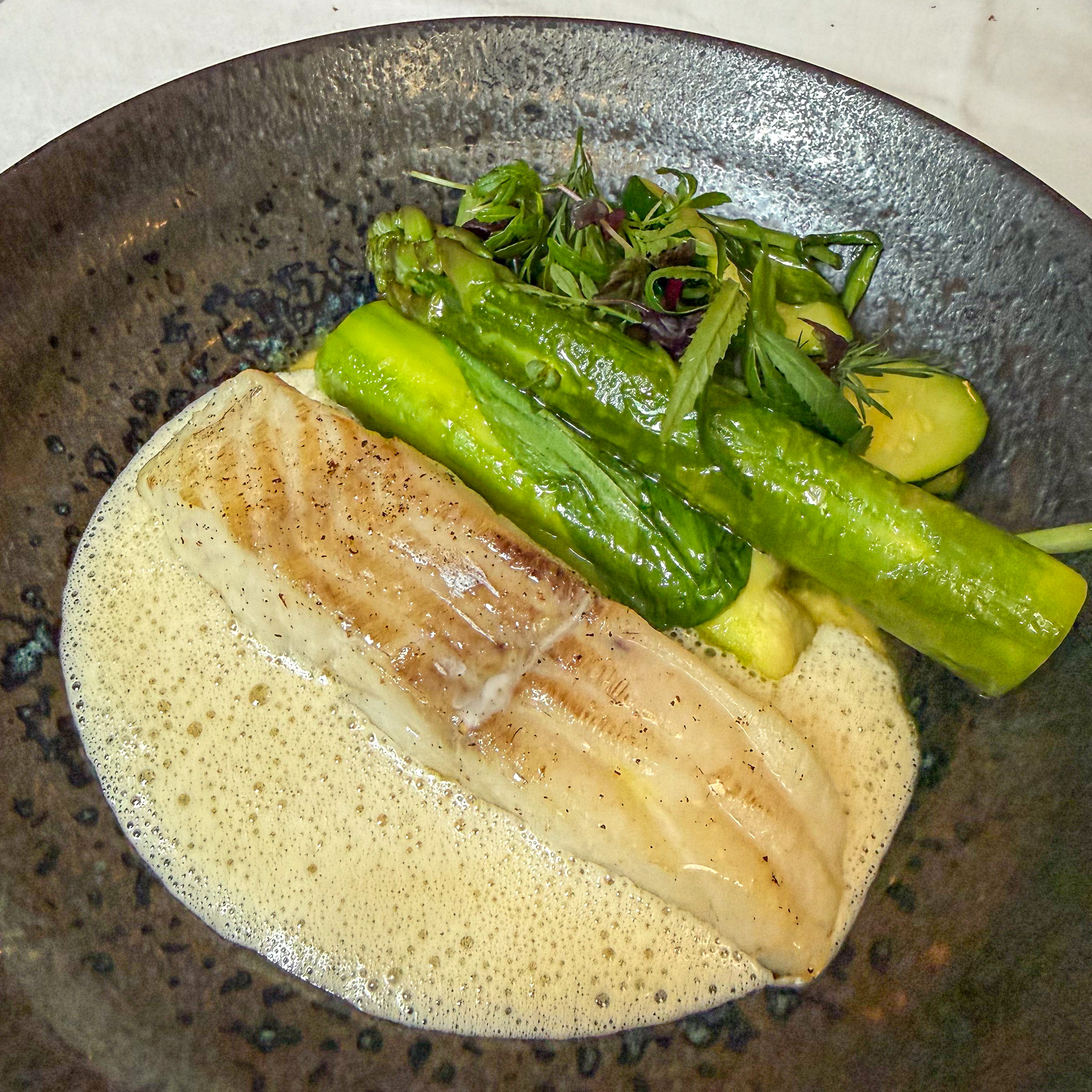 Line-caught yellow pollack with green asparagus, courgette and Thai marinière sauce at Le Bon Saint-Pourçain, Paris 6th